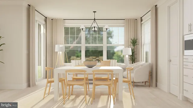a view of a dining room with furniture large windows and wooden floor