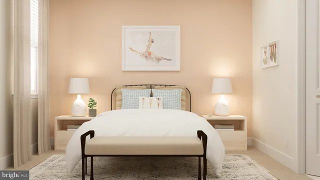 a bedroom with a bed and a lamp on table