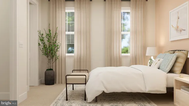 a bedroom with a bed and a potted plant