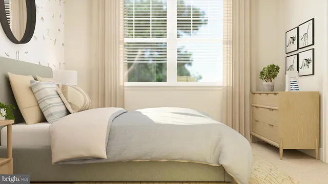 a living room with a bed furniture and a window