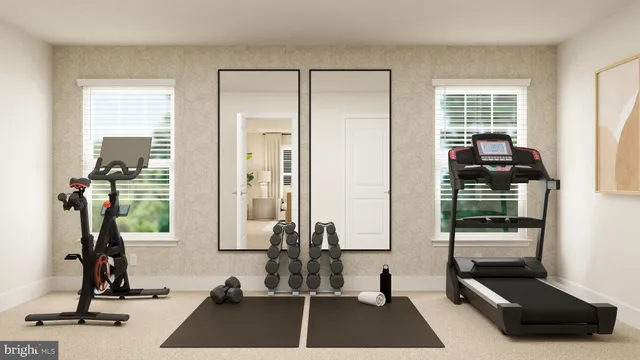 a room with gym equipment and a large window