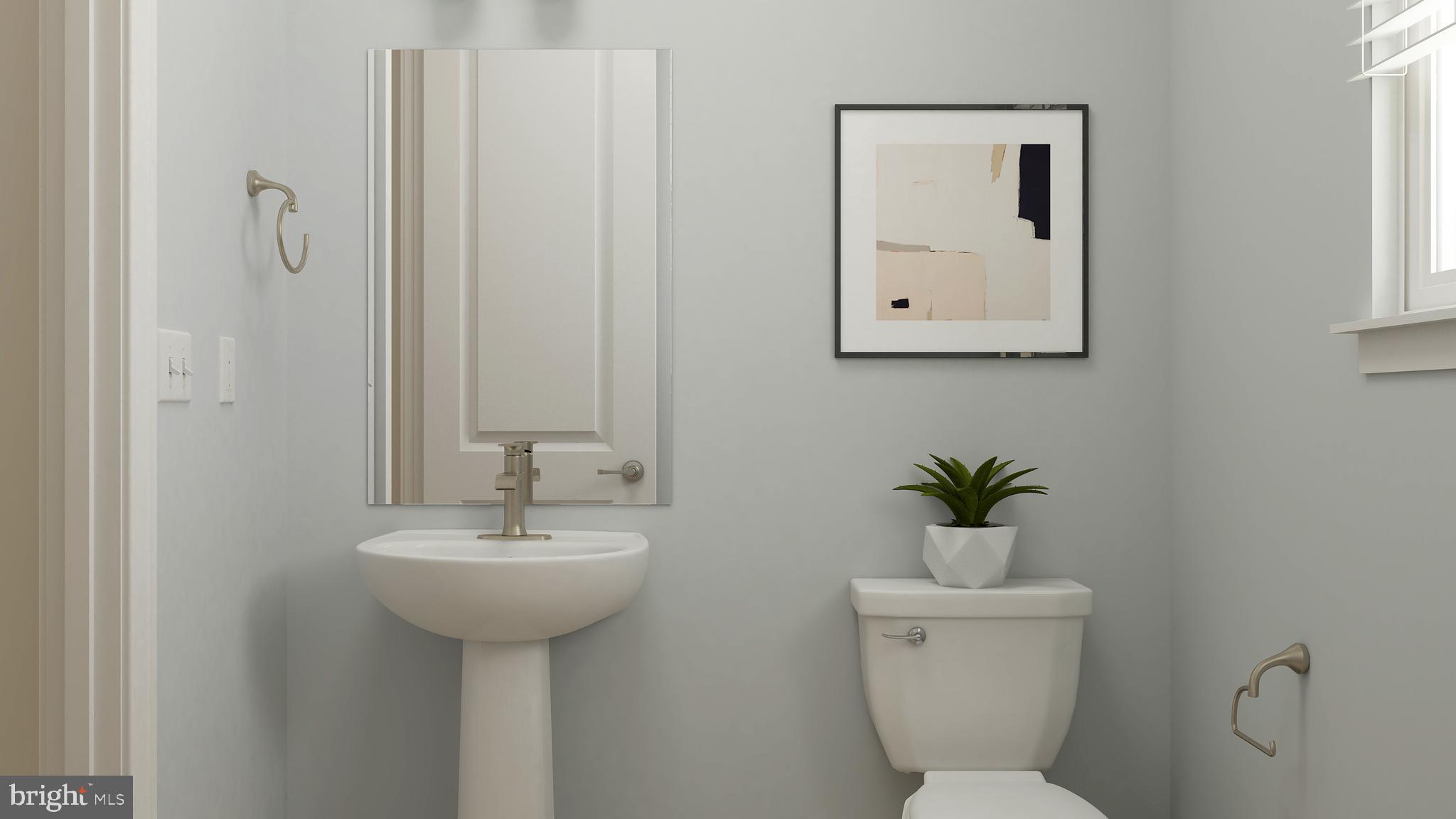 19015 Meadow Sun Way Boyds, MD 20841 - Photo 37 of 44 a bathroom with a toilet sink and mirror