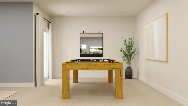 a living room with a table and a potted plant