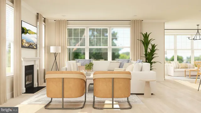 a living room with fireplace furniture and a large window