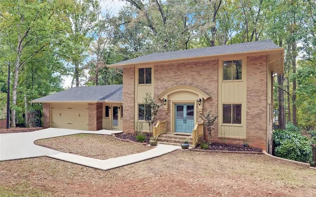a front view of a house with garden