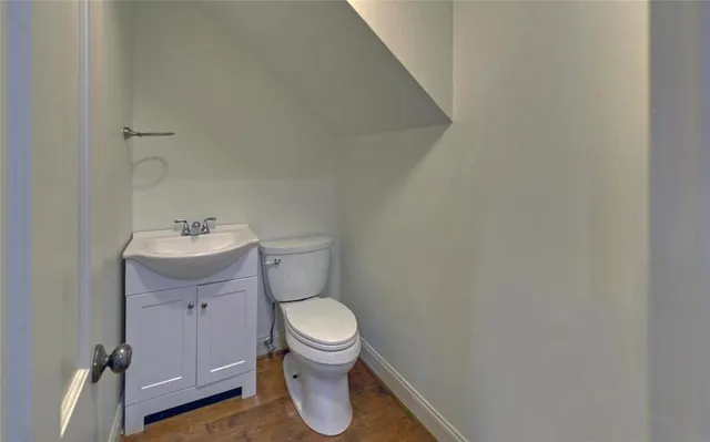 a view of an empty room with a closet