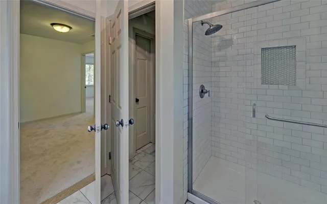 a view of an empty room with a window