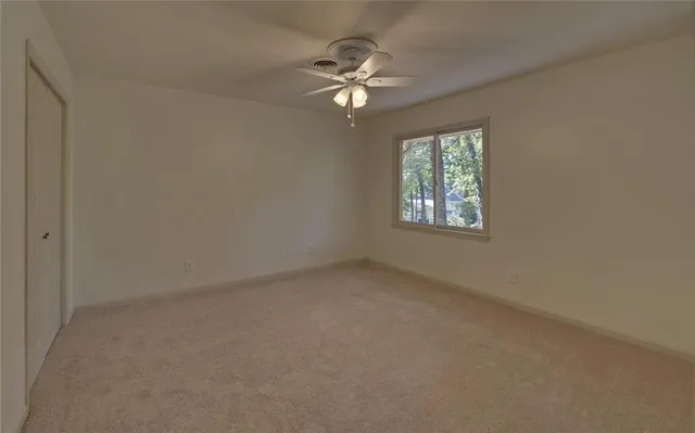 a view of a house with backyard from a balcony