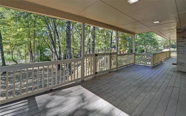 a view of a wooden house with a yard
