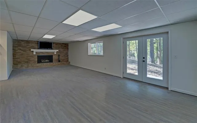 an open kitchen with a sink and a stove top oven