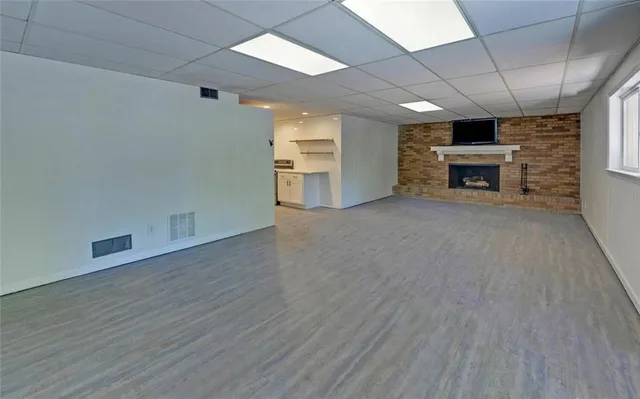 a kitchen with a sink appliances and cabinets