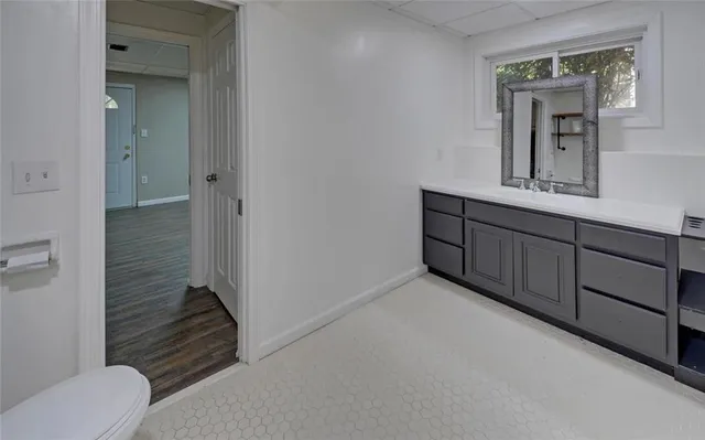 an aerial view of a house with a yard and garden