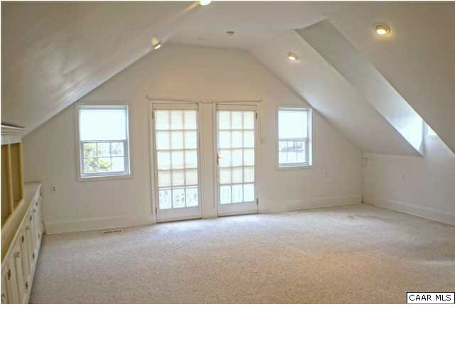 5445 Louisa Road Keswick, VA 22947 - Photo 16 of 39 a room with windows and a projector screen