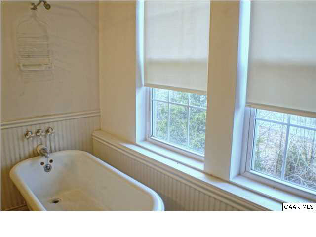 5445 Louisa Road Keswick, VA 22947 - Photo 21 of 39 a bathroom with a bathtub and a window