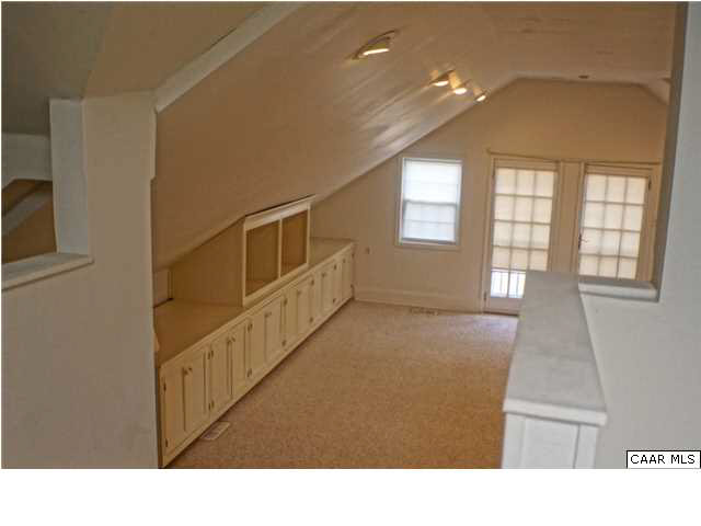 5445 Louisa Road Keswick, VA 22947 - Photo 23 of 39 a upper view of an empty room with wooden floor and windows
