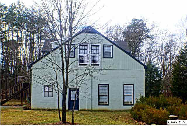5445 Louisa Road Keswick, VA 22947 - Photo 4 of 39 a front view of a house with a yard