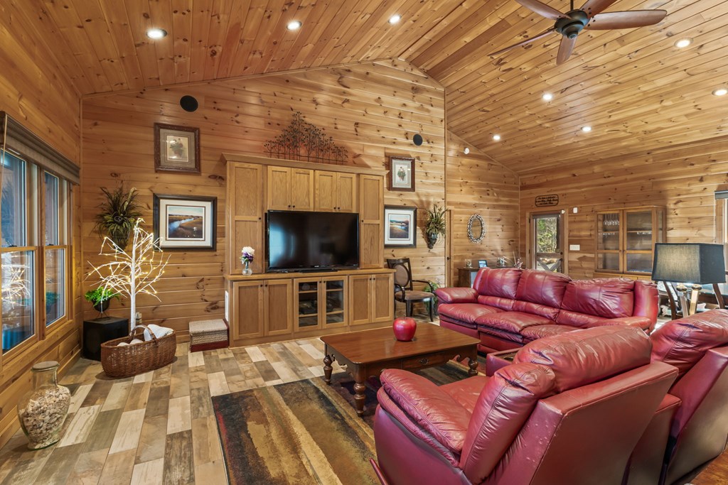 45 Turning Lay Road Morganton, GA 30560 - Photo 15 of 48 a living room with furniture a flat screen tv and a fireplace