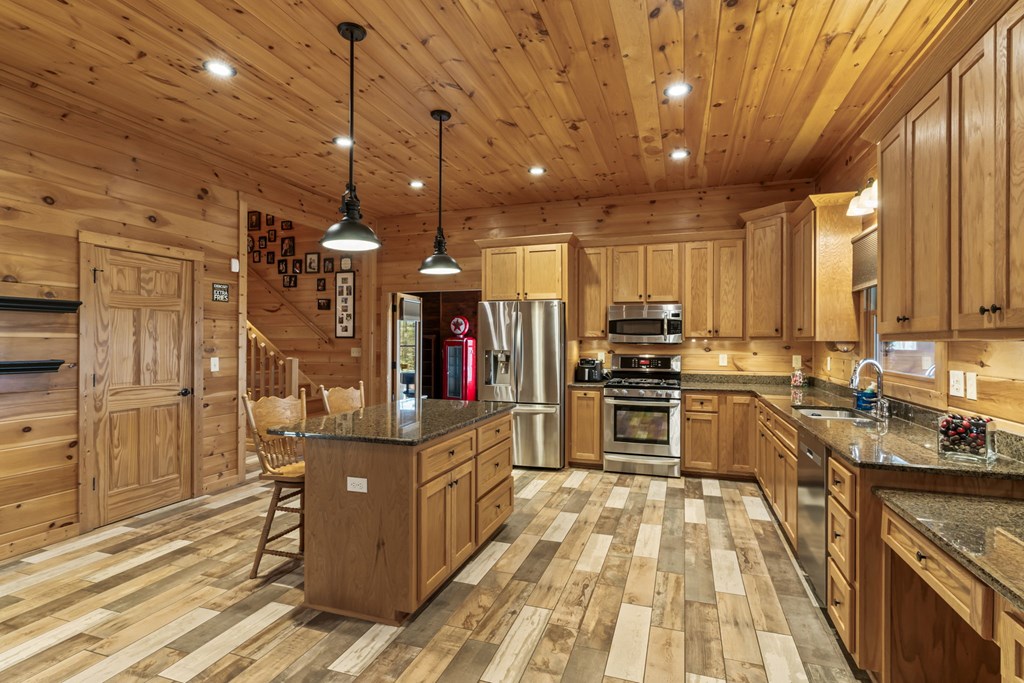 45 Turning Lay Road Morganton, GA 30560 - Photo 2 of 48 a kitchen with stainless steel appliances granite countertop a stove and a refrigerator