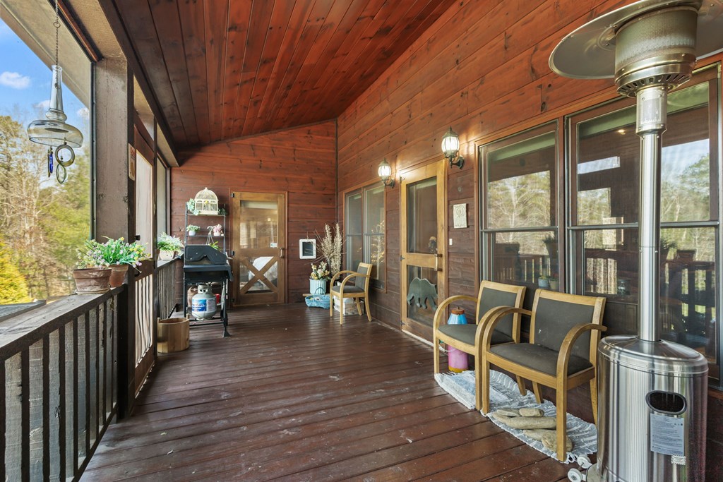 45 Turning Lay Road Morganton, GA 30560 - Photo 25 of 48 a view of a balcony with chairs and wooden floor