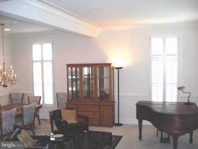 321 Cameron Station Boulevard Alexandria, VA 22304 - Photo 2 of 19 a living room with furniture and a window