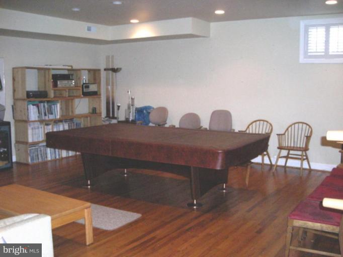 321 Cameron Station Boulevard Alexandria, VA 22304 - Photo 9 of 19 a view of a dining room with furniture and wooden floor