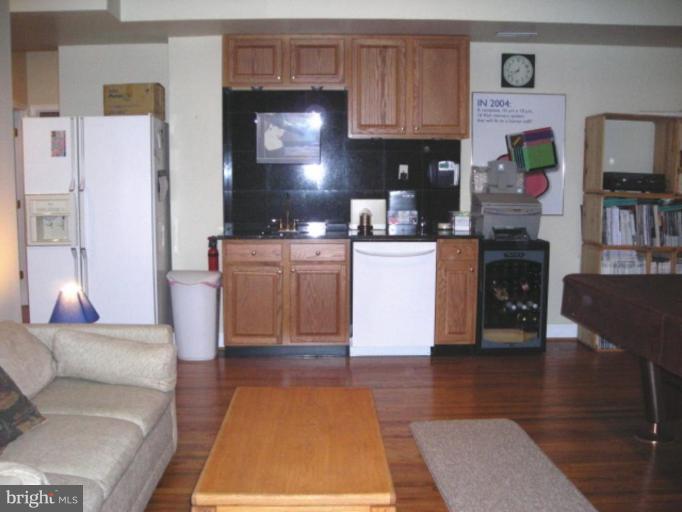 321 Cameron Station Boulevard Alexandria, VA 22304 - Photo 10 of 19 a living room with furniture and a fireplace