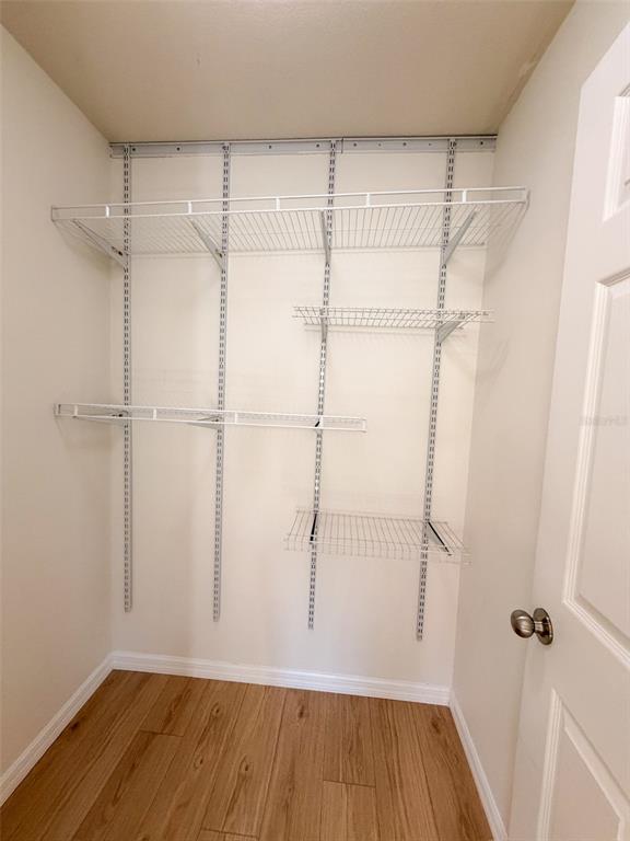 4747 Chatterton Way Riverview, FL 33578 - Photo 18 of 24 a view of a room with wooden floor and cabinet