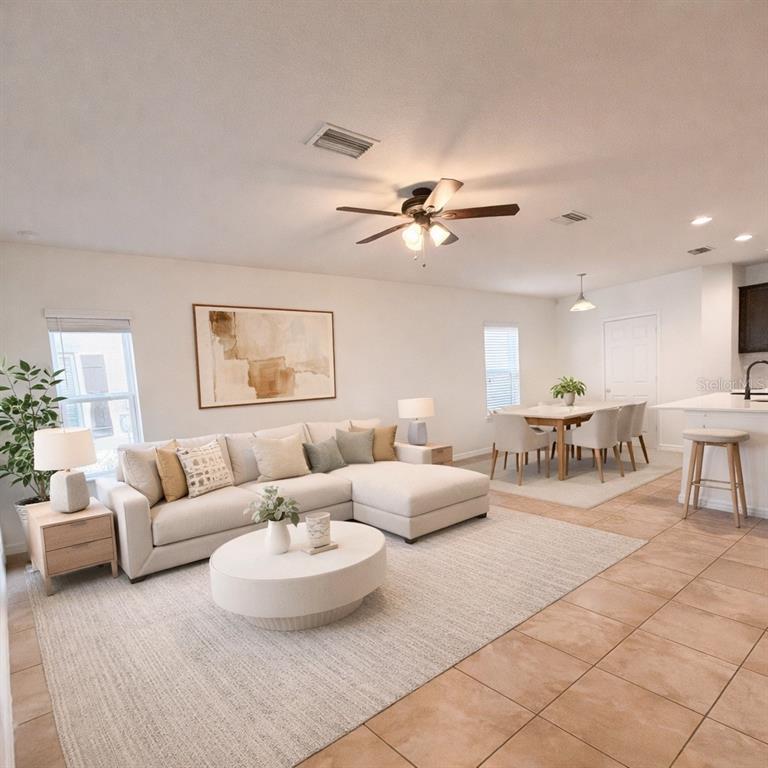 4747 Chatterton Way Riverview, FL 33578 - Photo 2 of 24 a living room with furniture and a large window