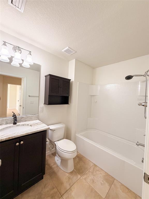 4747 Chatterton Way Riverview, FL 33578 - Photo 23 of 24 a bathroom with a toilet a sink a mirror and bathtub