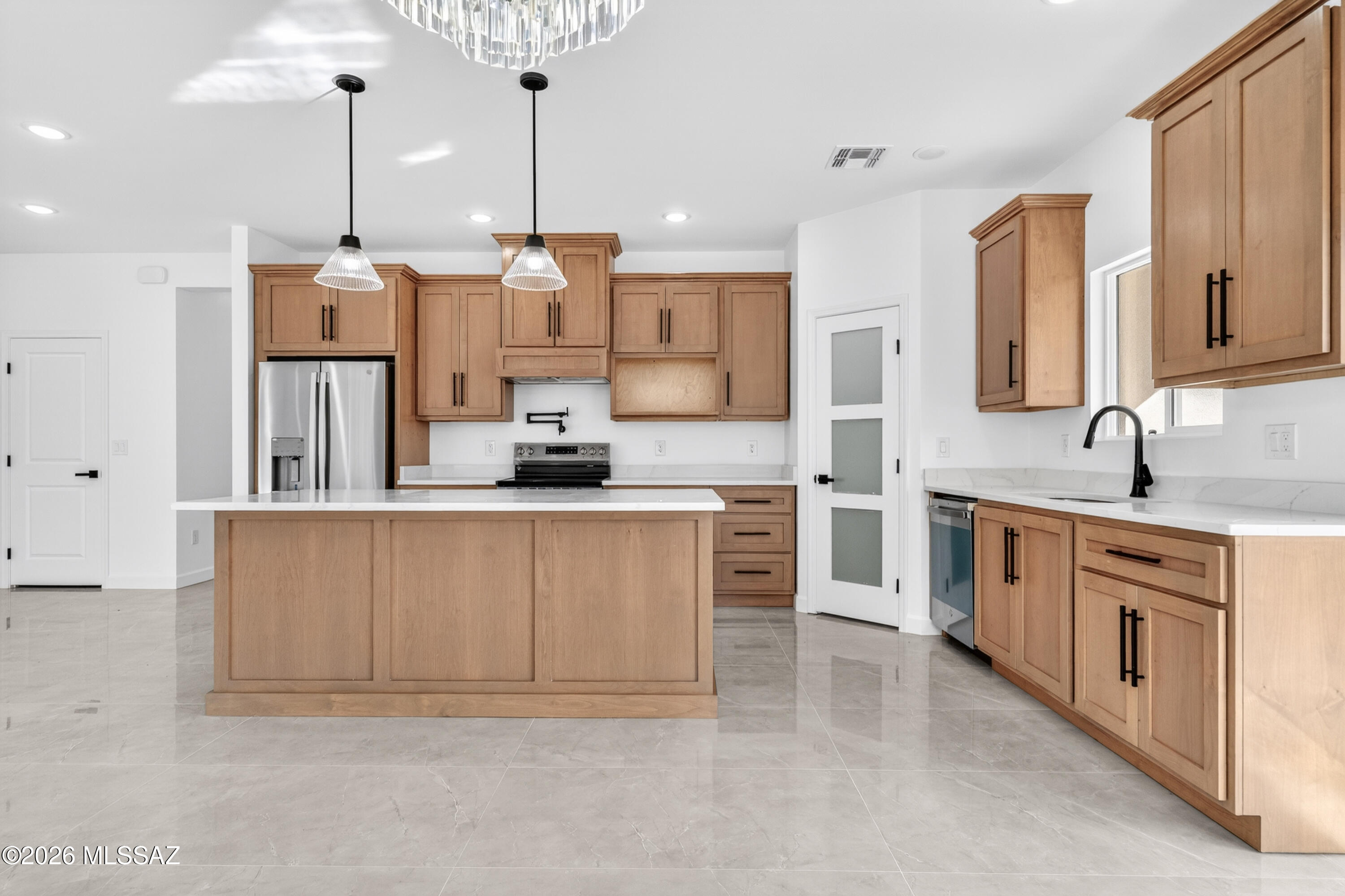 1834 Circulo Glorieta Rio Rico, AZ 85648 - Photo 13 of 35 a large kitchen with stainless steel appliances a sink and cabinets
