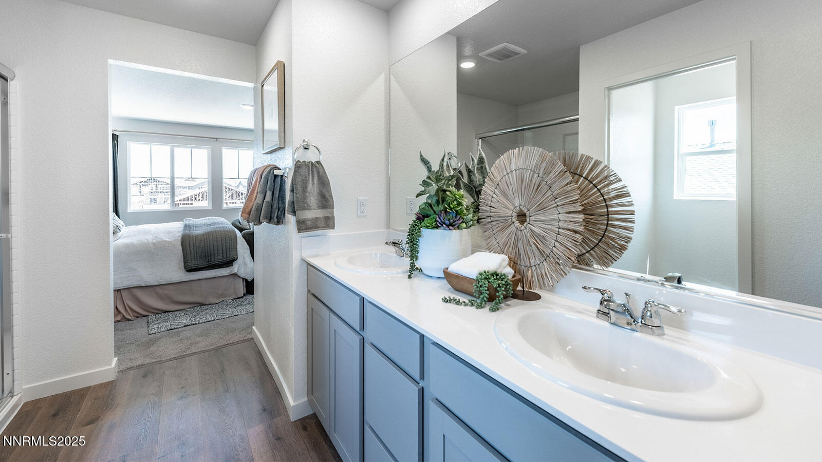 7540 Editor Drive Reno, NV 89506 - Photo 15 of 22 a en suite bathroom with a granite countertop double vanity sink and a mirror