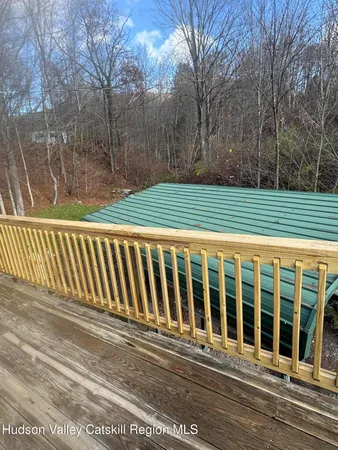 a front view of a house with a deck