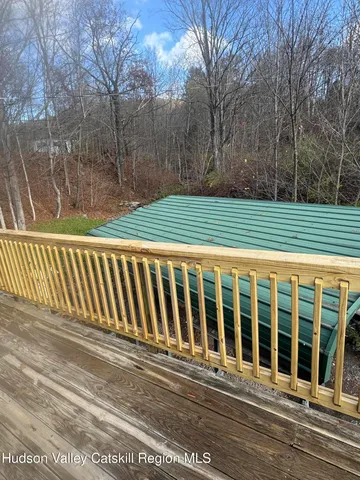 a front view of a house with a deck