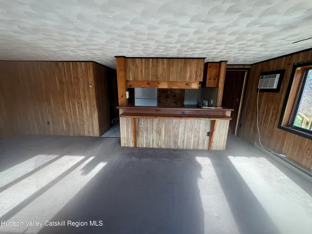 a kitchen with a refrigerator and a stove