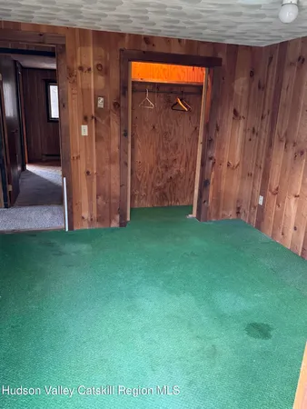 a bathroom with a toilet and a shower curtain