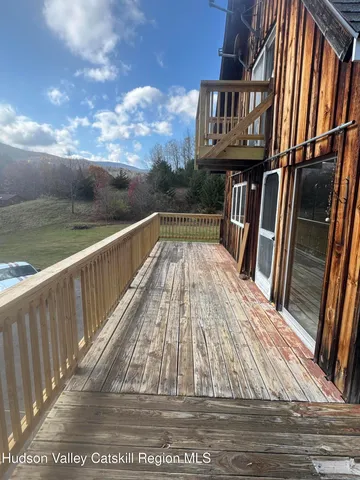 a view of balcony with wooden floor