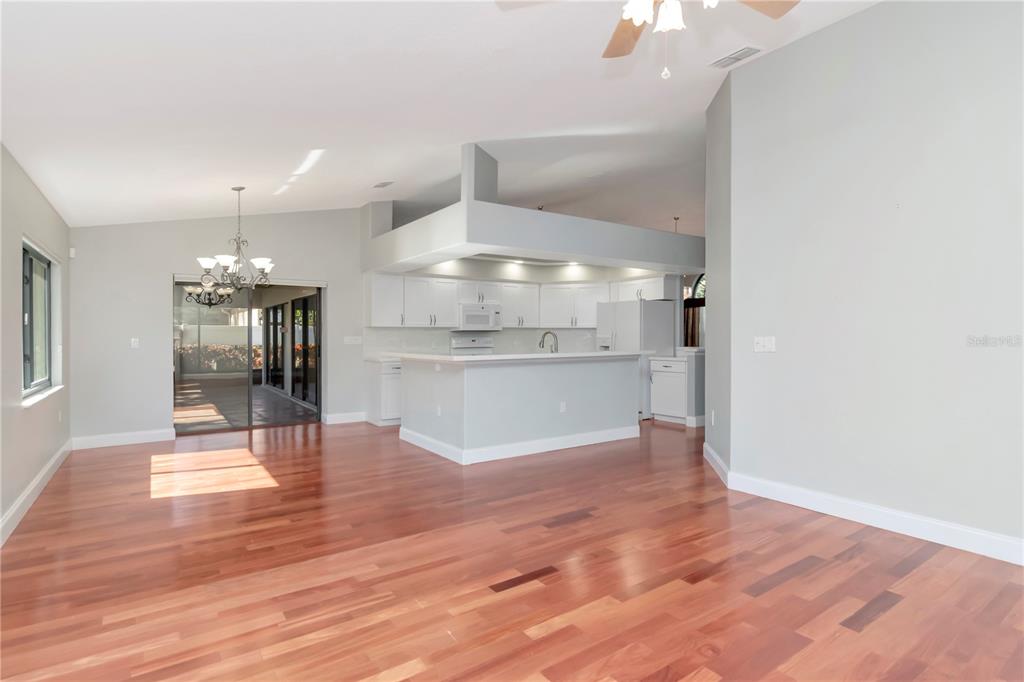4938 Yellowstone Drive New Port Richey, FL 34655 - Photo 15 of 51 a view of a kitchen with wooden floor and a kitchen