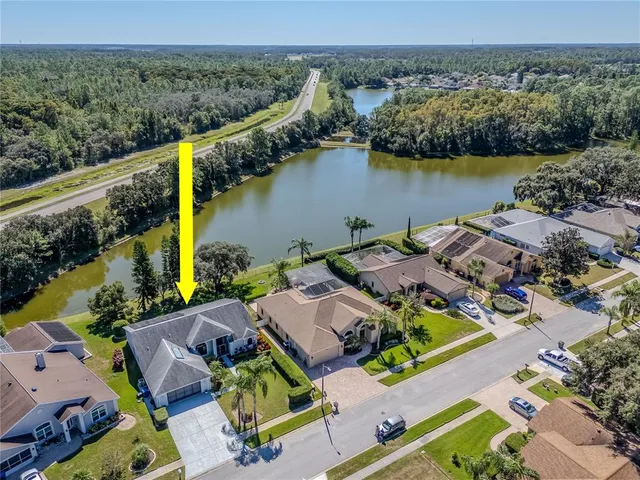 an aerial view of houses with yard