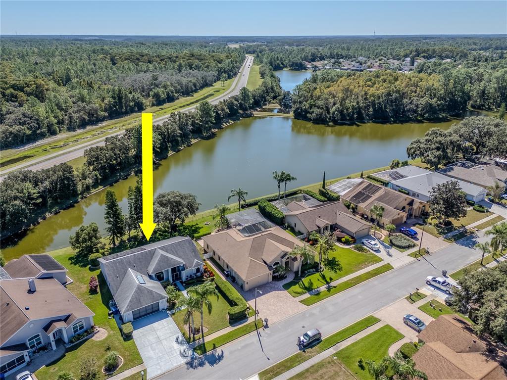 4938 Yellowstone Drive New Port Richey, FL 34655 - Photo 2 of 51 an aerial view of houses with yard