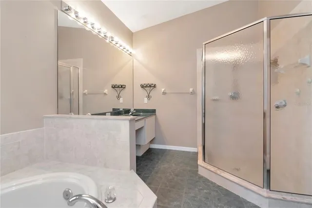 a bathroom with a bathtub and a sink