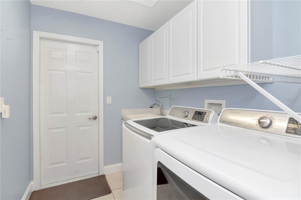 4938 Yellowstone Drive New Port Richey, FL 34655 - Photo 26 of 51 a kitchen with a sink and cabinets