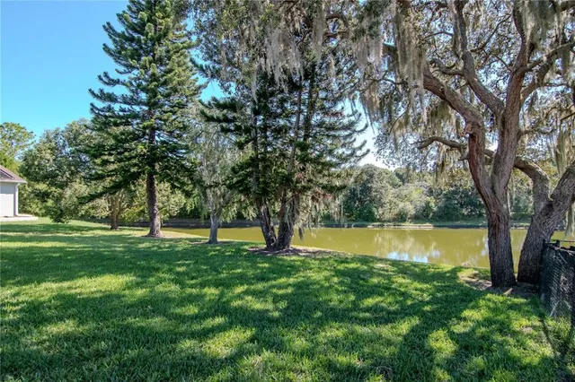 a view of outdoor space with deck and trees