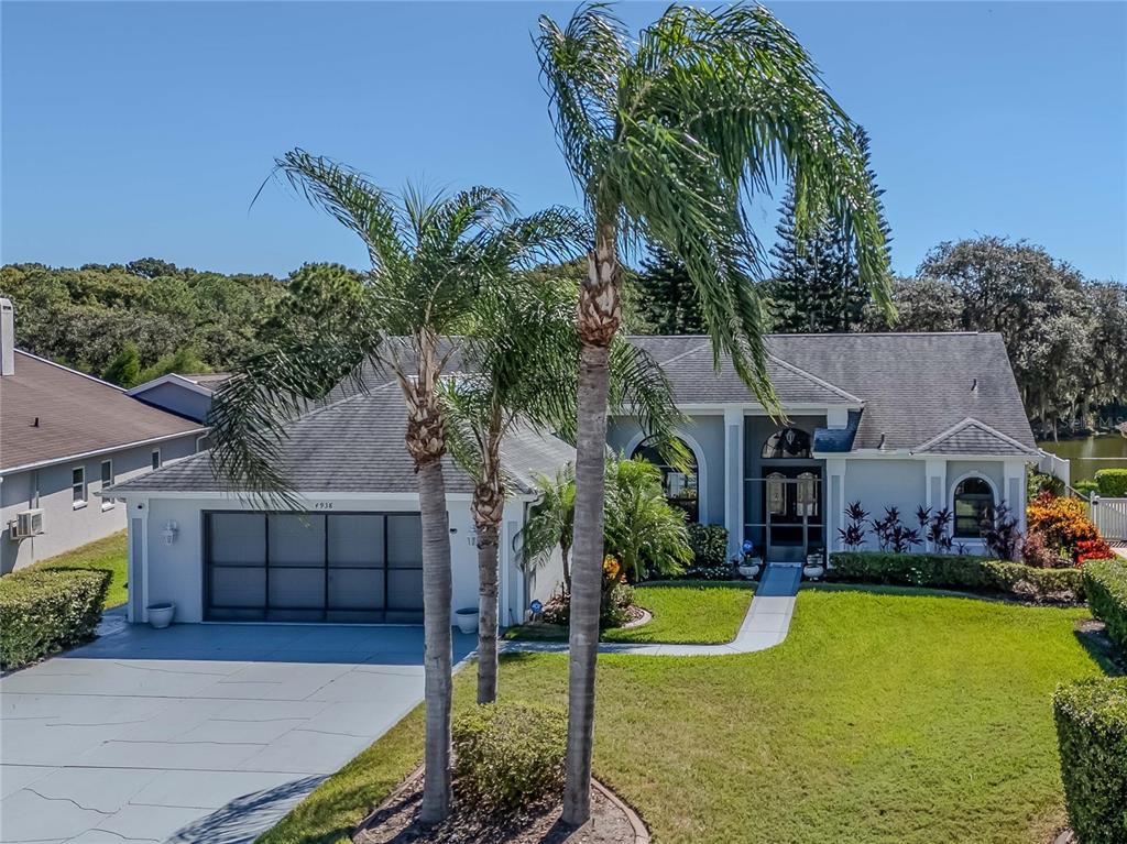 4938 Yellowstone Drive New Port Richey, FL 34655 - Photo 3 of 51 a view of a house with swimming pool