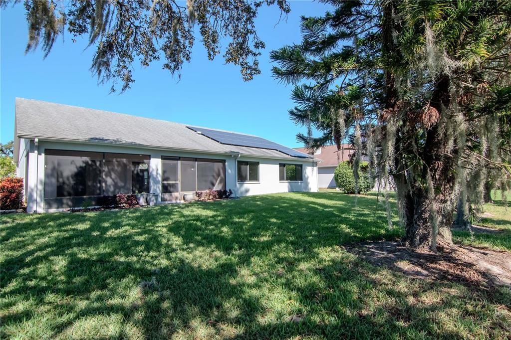 4938 Yellowstone Drive New Port Richey, FL 34655 - Photo 35 of 51 a front view of a house with a garden