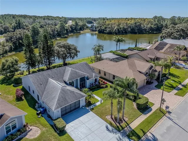 an aerial view of a house with garden space and outdoor seating