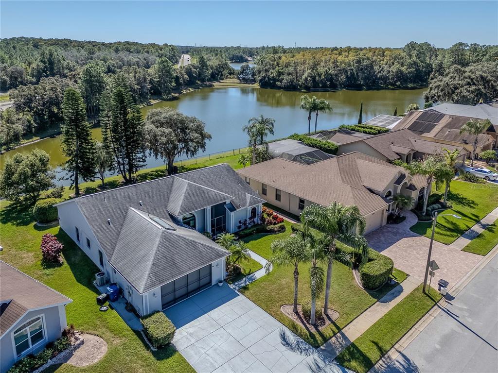 4938 Yellowstone Drive New Port Richey, FL 34655 - Photo 42 of 51 an aerial view of a house with garden space and outdoor seating