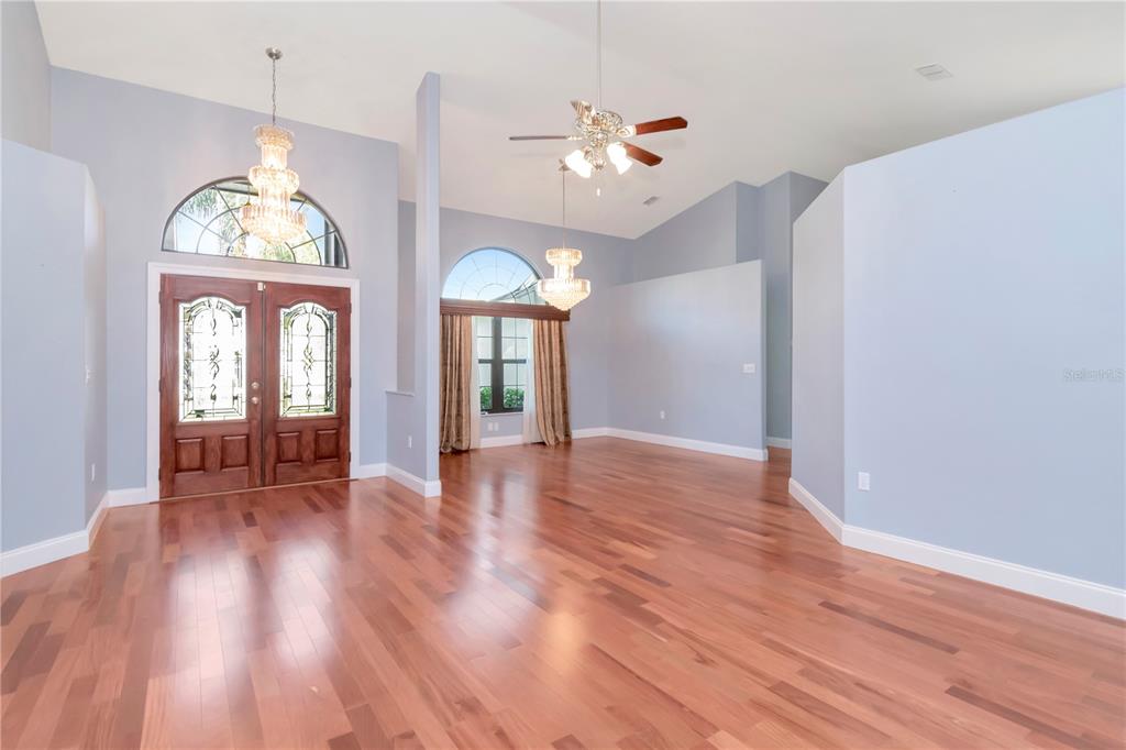 4938 Yellowstone Drive New Port Richey, FL 34655 - Photo 8 of 51 a view of a room with wooden floor fan and window