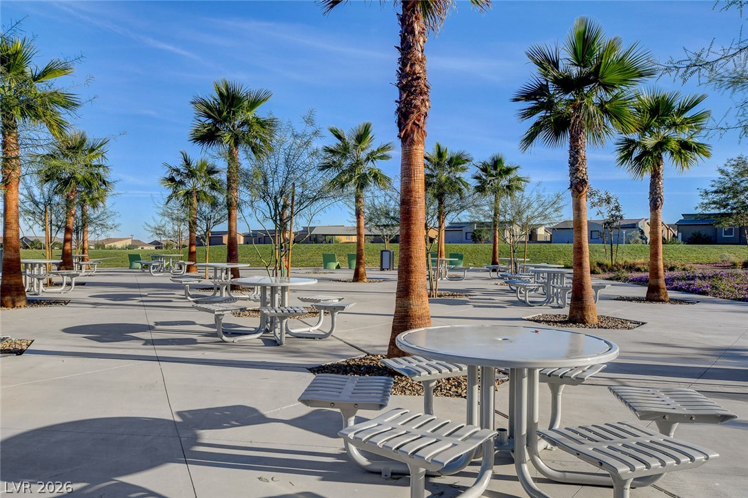 7330 North Decatur Boulevard, Unit 6 North Las Vegas, NV 89084 - Photo 32 of 42 Palm-lined outdoor area offers abundant seating for leisurely gatherings or community events.