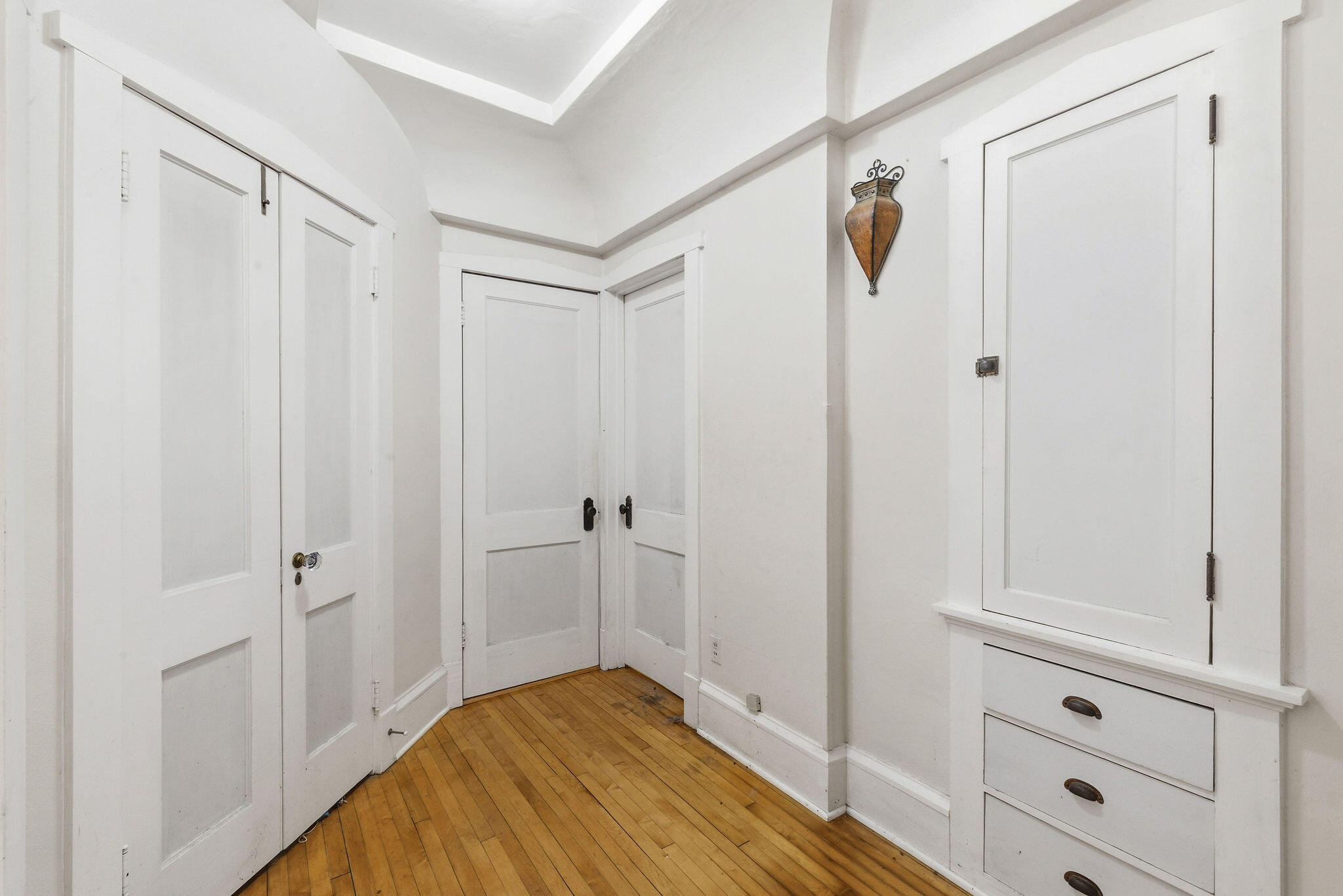 1526 North Hawley Road, Unit 1528 Milwaukee, WI 53208 - Photo 19 of 30 Great storage on the left & right, doors to primary bedroom & 2nd door to kitchen in the middle