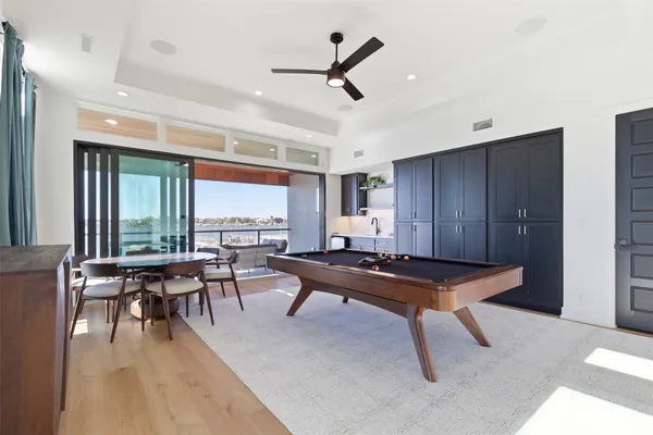 a living room with furniture a window and a table